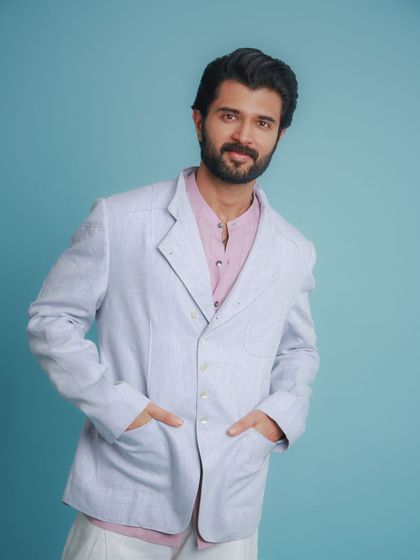 Vijay Deverakonda in a layered summer look from Khanijo. The light blue linen blazer over a pink shirt is a fresh and modern color combination.