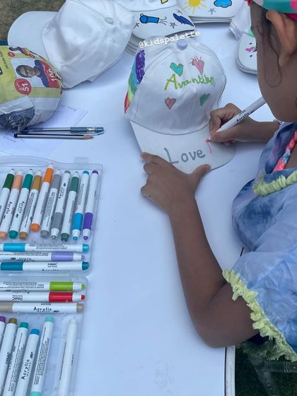 Writing "Love" on a hand-decorated cap. This activity was featured in Sunday Midday, and I'm so grateful for the recognition of the simple joy it brings.