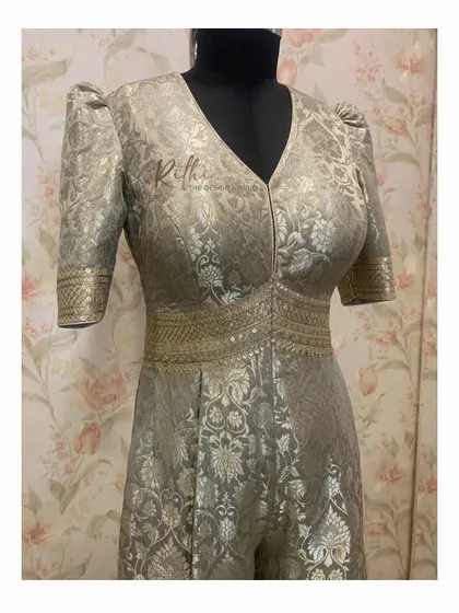 A detailed look at the bodice of the Banarasi jumpsuit, showing the puffed sleeves and the defined waist created with intricate weaving.