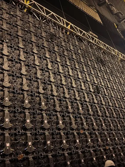 A behind the scenes look at the complex rigging of a giant LED wall at the NMACC. This highlights the technical precision and large scale infrastructure our team assembles for major event productions.