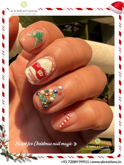 Intricate Christmas nail art featuring a variety of detailed, festive 3D embellishments, including a house, candy cane, and a jeweled Christmas tree.