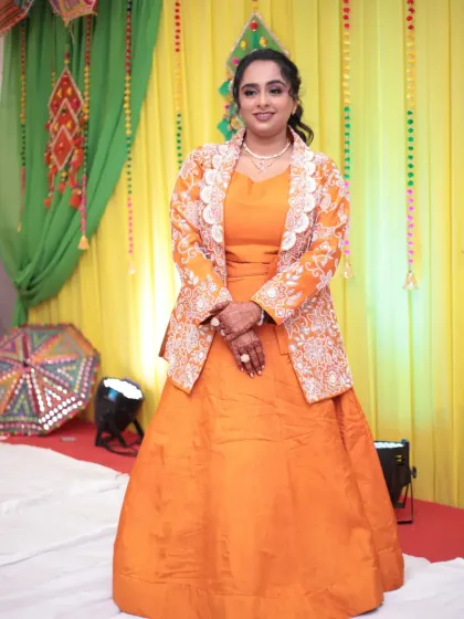 Another full-length shot showing the flow and color of her beautiful pre-wedding attire.