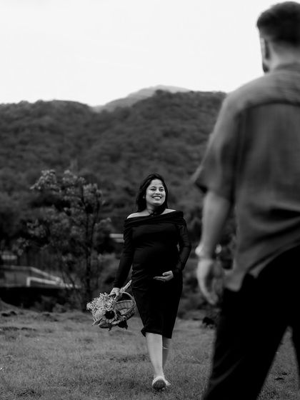 A black and white "follow me" shot, with her walking towards her partner with a smile. The perspective creates a lovely sense of invitation and connection.