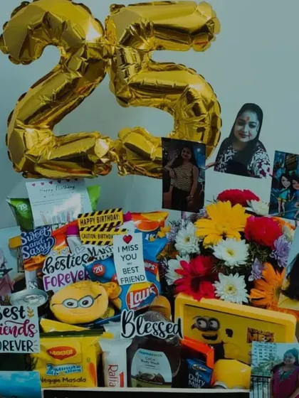 A 25th birthday hamper designed for a best friend. This gift includes fresh flowers, snacks, a minion-themed item, and personal photos, all tied together with a '25' foil balloon to mark the quarter-century celebration.