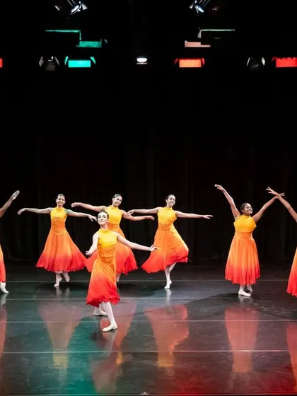 The culmination of countless hours at the barre. Our students perform a Jazz Waltz on stage, showcasing their coordination, artistry, and the magic of a group performance. This is where individual discipline transforms into collective beauty.