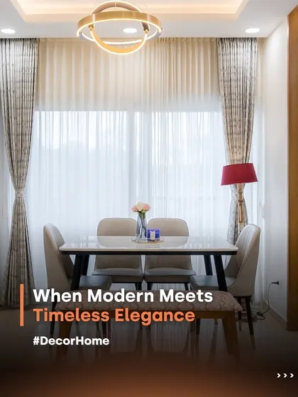 Modern design meets timeless elegance in this beautiful dining area. Sheer curtains allow natural light to flood the space, highlighting the sleek dining table and creating a warm, inviting atmosphere for every meal.