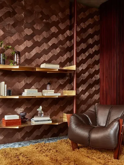 In the Marqueteries collection, wood comes alive. This reading nook is enveloped in a rhythmic, wavy wood pattern, where every fragment whispers a unique story of artisanal skill and natural beauty.