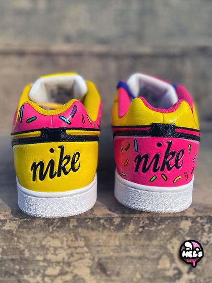 A look at the back of our Simpsons custom Nikes. The heels are painted in the signature pink and yellow, with the Nike logo written in the classic Simpsons font.