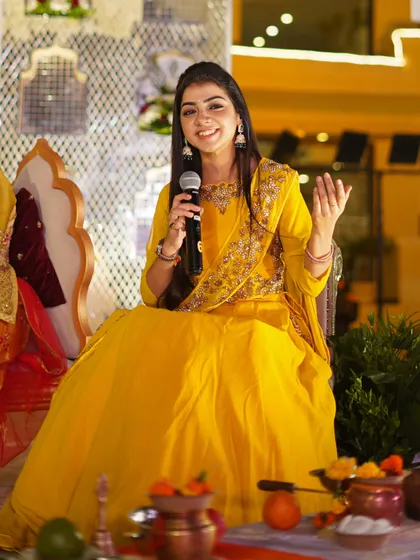 Sending love through my singing. A seated performance shot, showing a more intimate setup.
