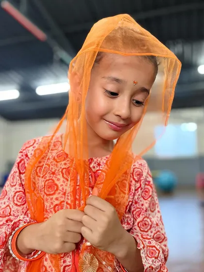 A sweet, demure pose. We love seeing the different sides of our students' personalities come out in the studio.