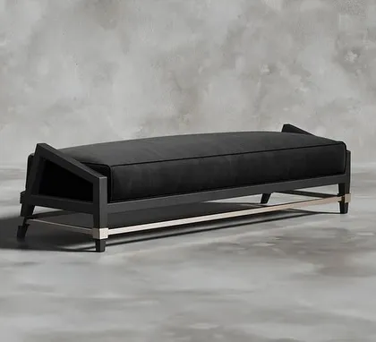 Introducing the epitome of lavishness and sophistication. This bench features a sleek, angular black wood frame, a plush black cushion, and contrasting metal details on the stretcher and feet.