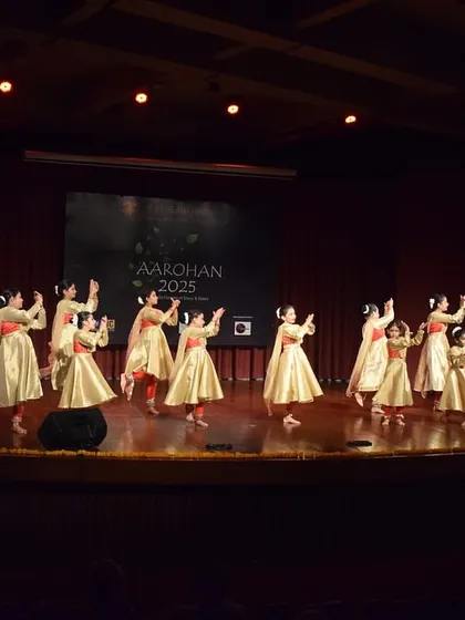 Our students performing at the prestigious Aarohan 2025 concert. This wide shot captures the grandeur of the stage and the synchronized grace of our Kathak dancers performing with live musicians, a testament to the professional opportunities we provide.