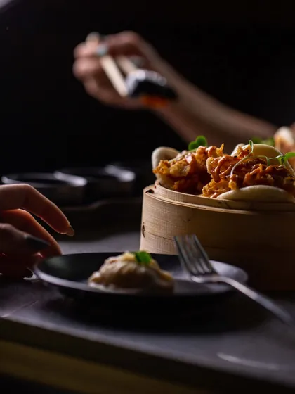Our Mushroom Bao offers a perfect meeting of textures. We fill soft, steamed buns with sautéed enoki mushrooms to create a small plate that is packed with crunch and umami.