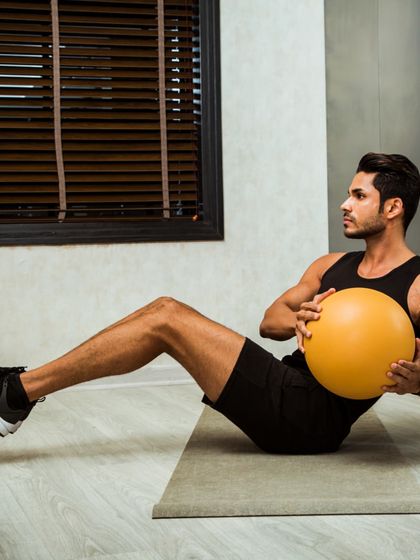 The Russian twist with a medicine ball is a fantastic exercise for building rotational core strength and sculpting your obliques.