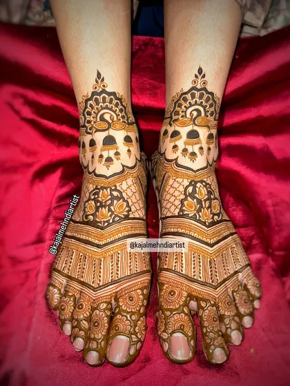 A beautiful bridal leg design with peacocks, bells, and lotus touches, creating a rich and traditional look.