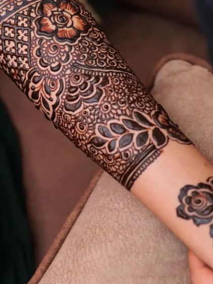 A close-up of the application process, showing the fine tip of my cone creating delicate floral details.