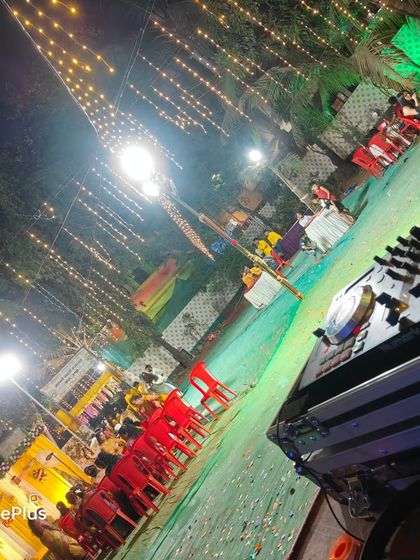 My view from the DJ booth during a nighttime Haldi event. The combination of overhead fairy lights and my professional console ensures the music and the festive atmosphere continue long after the sun goes down.