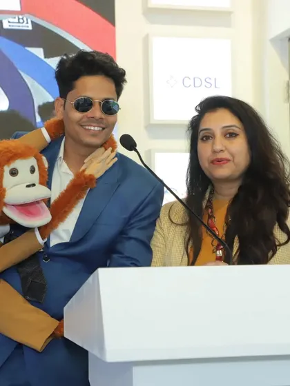 At the podium with an official from CDSL during an investor awareness event. These collaborations are key to reaching a wider audience and making financial knowledge accessible to all.