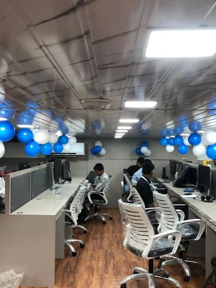 The main workspace decorated for the office opening. We placed balloon bunches along the ceiling to add a celebratory feel without disrupting the work environment.