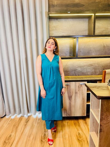 Another example of accessorizing a simple outfit. This teal kurta set is instantly glammed up with a pair of bold red heels, creating a striking color contrast.