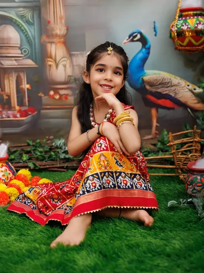 An older girl poses gracefully as Radha, showcasing that these sessions are for kids of all ages.