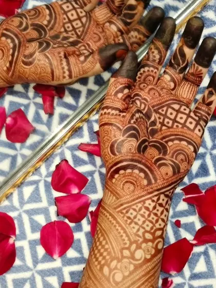 A beautiful photo showing a completed henna stain next to a mirror, a promotion for my classes.