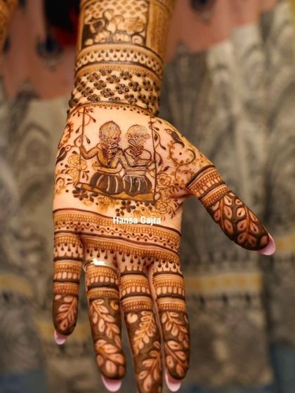 A design that tells a story of sisterhood. This custom mehendi for the bride's sister features a portrait of them on a swing, capturing a shared childhood memory and the unbreakable bond they share.