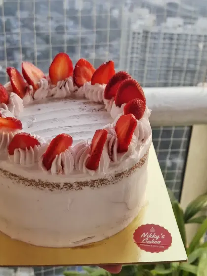 When strawberries are in season, my fresh strawberry cream cake is a must have. It's a light, eggless cake layered with fresh cream and topped with juicy, sliced strawberries for a simple yet delicious treat.
