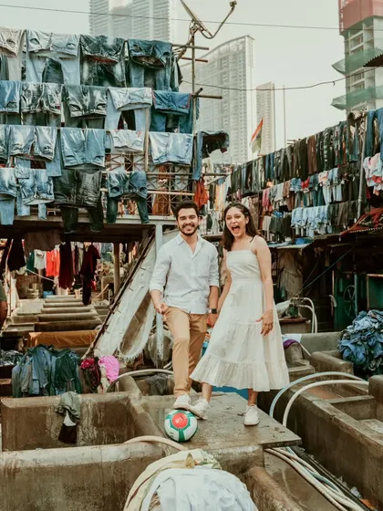 A fun and unconventional pre-wedding photo taken at the famous Dhobi Ghat in Mumbai. We love exploring unique locations that tell a different kind of Mumbai story.