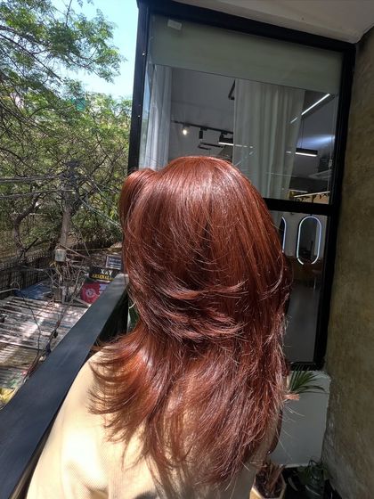 Another shot of the ginger hair in the sun, showing its vibrant tones and healthy shine.