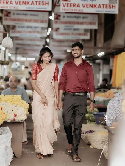A candid shot of the couple walking through the famous Devaraja Market in Mysore, surrounded by the sights and sounds of the city.