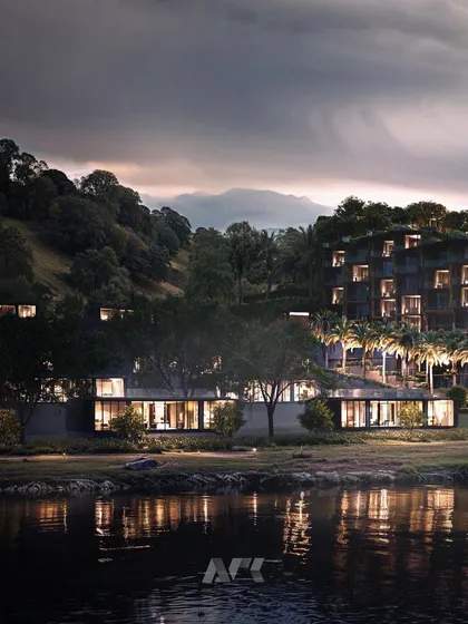 A nighttime view of the Westin Nashik. The warm interior lighting creates an inviting glow, contrasting with the dark, natural landscape and highlighting the hotel as a serene haven.