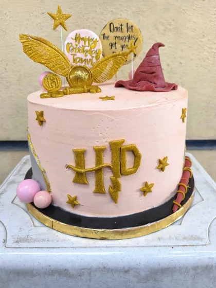 I solemnly swear I had the best time making this Harry Potter cake. It's packed with magical details like a golden snitch, the sorting hat, and the iconic HP logo, all handcrafted from fondant for the ultimate Potterhead's birthday.