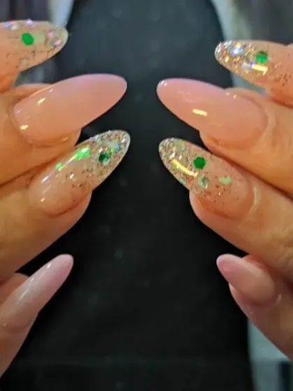 Another view of the beautiful holographic glitter accent nails on a long almond shape.