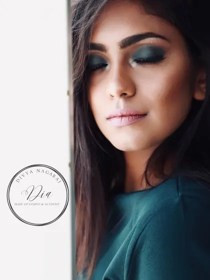 A close-up of a green-toned smoky eye. This is a great example of how to incorporate colour into a dramatic look for a unique and modern feel.