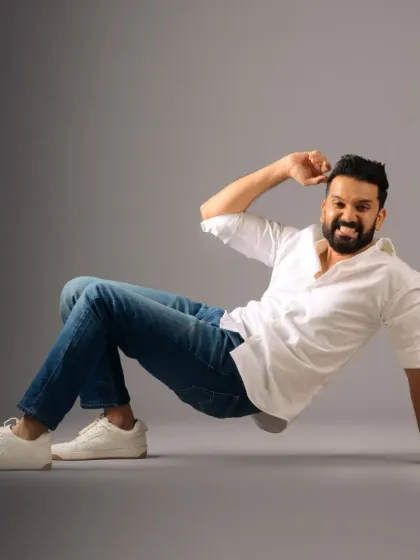 A dynamic and playful pose from Ankith Madhav's Valentine's Day shoot. The grooming is fresh and clean, matching the energetic and happy mood.