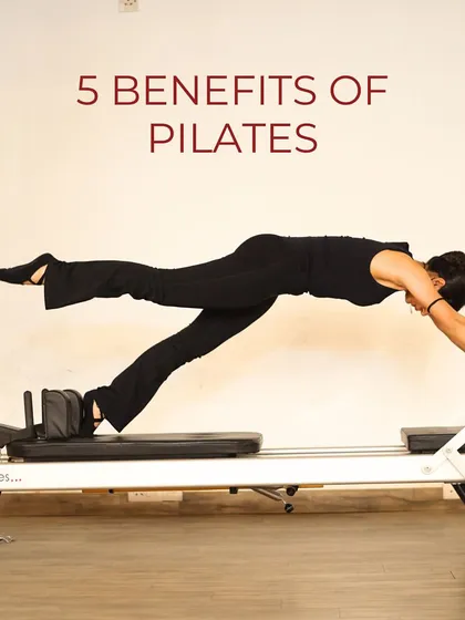 This image, showing a client in a powerful plank on the reformer, kicks off a series on the five key benefits of starting a Pilates practice.