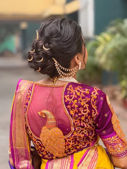 For my Maharashtrian brides, I create authentic and regal looks like this intricate bridal bun. The highlight is the traditional chandrakor accessory, which I place carefully to complement the textured updo and the stunning details of the Paithani saree. This style is all about honoring tradition with grace.