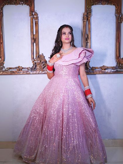 A full-length shot of the pink glitter gown, showing its beautiful A-line shape.