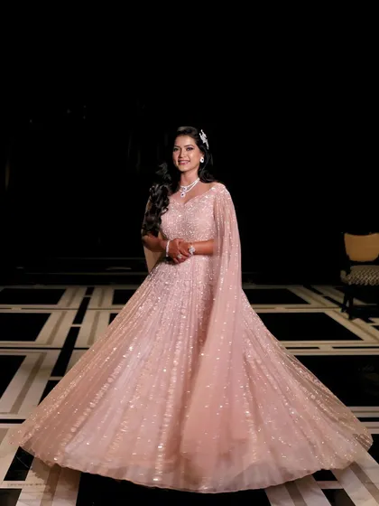 A full-length shot of this stunning engagement bride in her princess gown. The makeup is glamorous and radiant, ensuring she shines like a star on her special night.