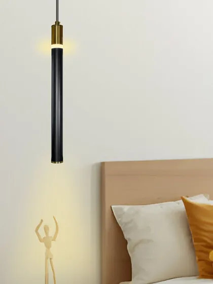 Even in a simple, neutral bedroom, this pendant light adds a touch of sophistication and provides useful task lighting.