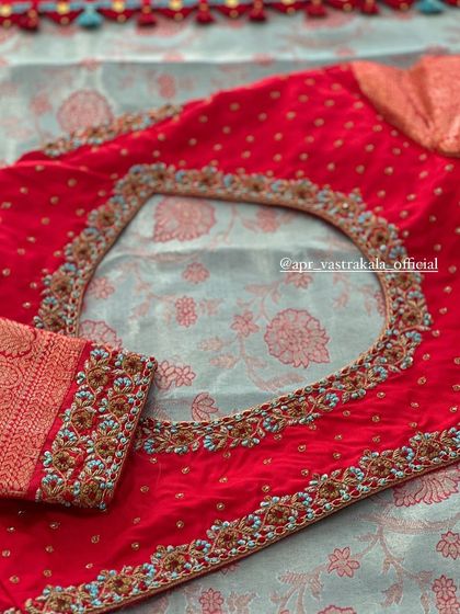 The back of the red blouse, with a circular cutout.