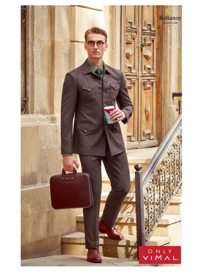 This look for Only Vimal showcases my approach to modern corporate styling. I paired a classic brown pinstripe suit with a contrasting green shirt and patterned tie to create a look that is both professional and distinctive.