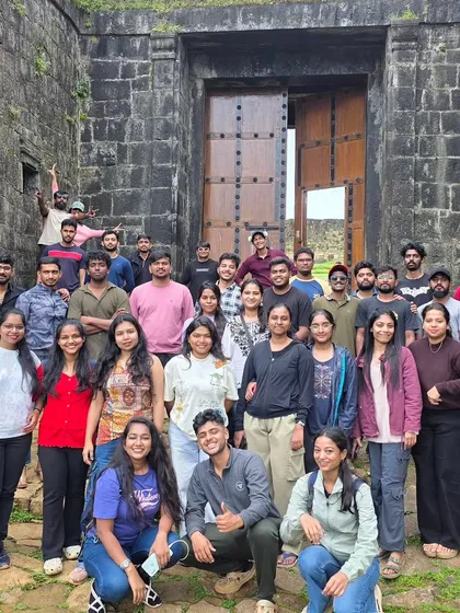 A group photo in front of an old fort gate during one of our weekend treks. We love mixing a bit of history with our nature adventures.