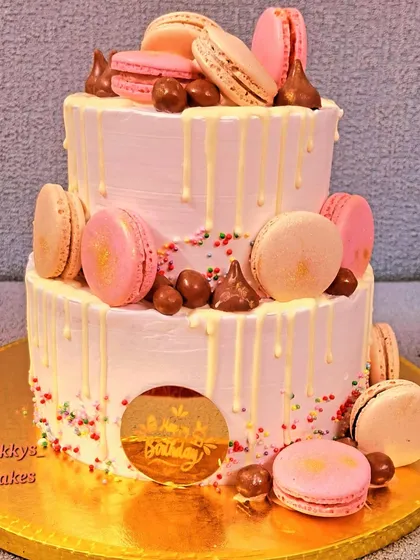 For a touch of elegance, I created this two-tier birthday cake decorated with delicate macarons and a white chocolate drip. It's a perfect choice for milestone birthdays, corporate events, or any celebration that calls for a sophisticated dessert.