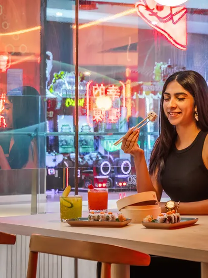 Great design is about creating memorable moments. Here at Lucky Chan, the warm glow of custom neon signs reflects off the surfaces, creating a vibrant, energetic backdrop for guests to enjoy their dining experience.