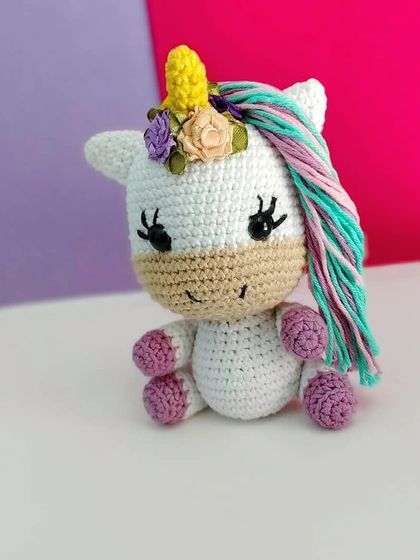 Another angle of the handmade unicorn amigurumi. She is small enough to sit in the palm of your hand and makes a very magical gift.