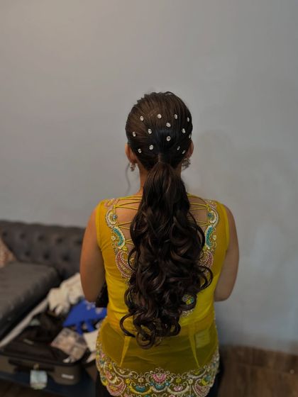 The full back view of the voluminous party ponytail.