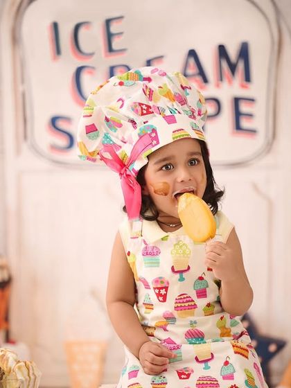 A candid moment of pure enjoyment. Our themed setups are designed to be interactive, allowing us to capture genuine expressions and actions.