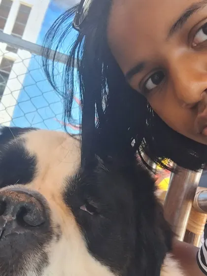 A close-up selfie with our sleepy-eyed St. Bernard, capturing a moment of quiet connection.